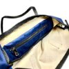 Sac Carolina Pretty Nana cuir nylon bleu porté main femme